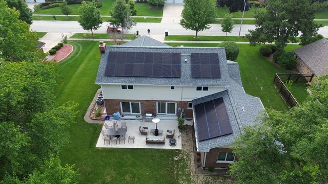 Solar panels on the rooftop of a house.